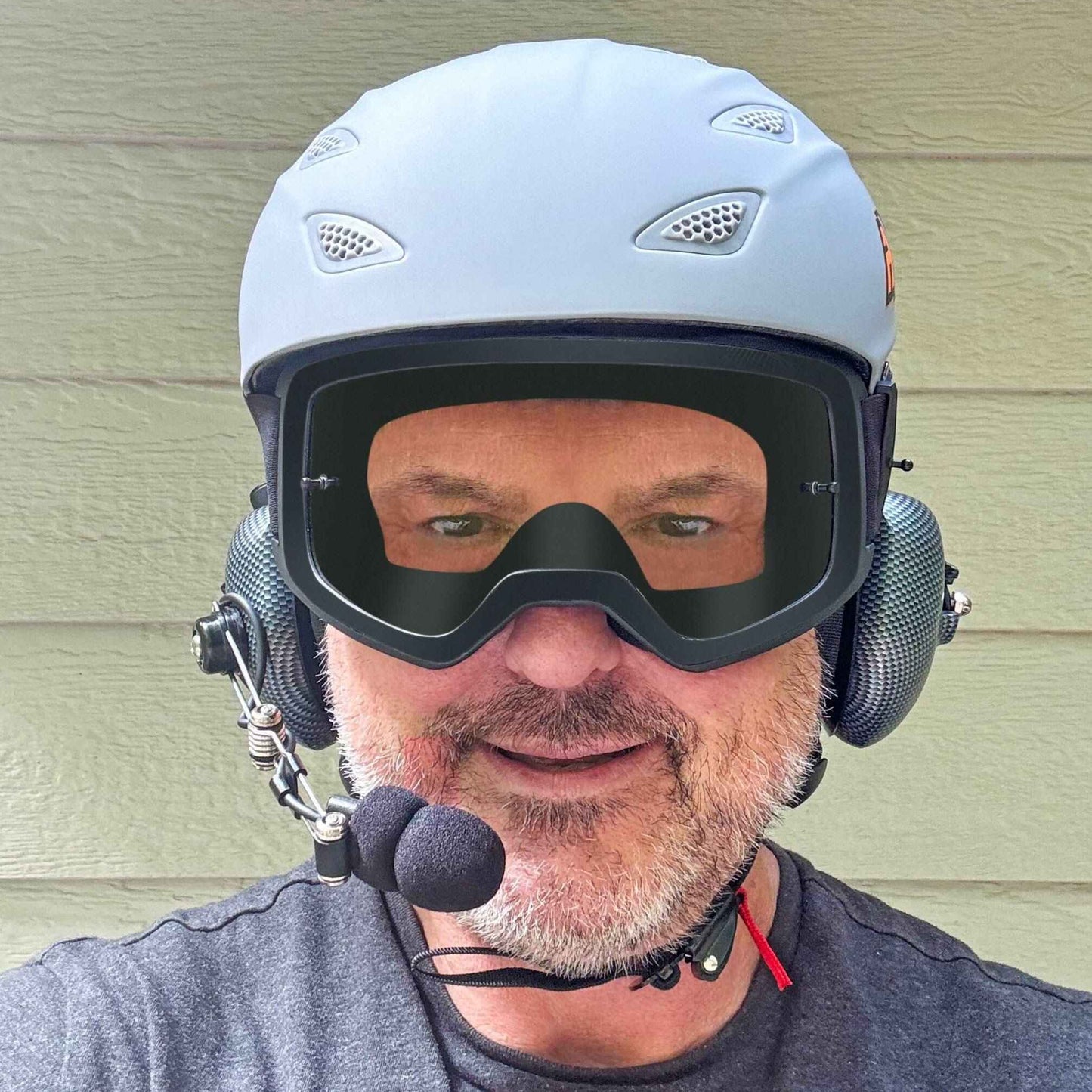 Person wearing AXEL GRIT DOT Helmet with goggles and headset intercom