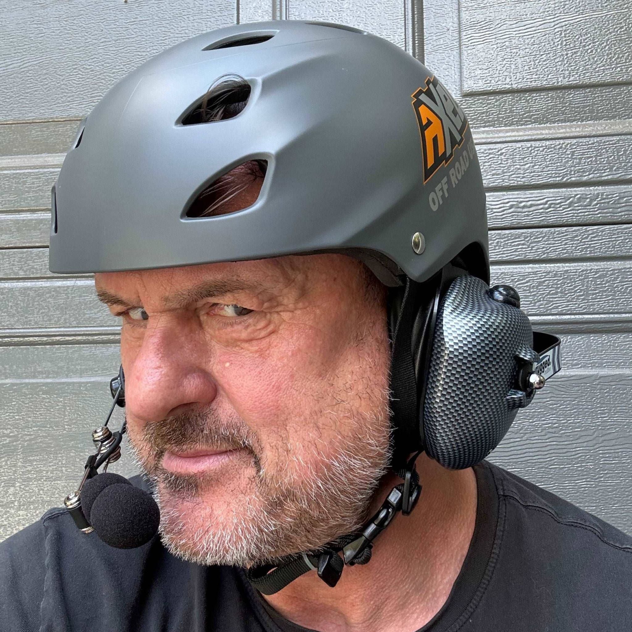 Man wearing AXEL Off Road Trail Helmet with rugged radios headset intercom