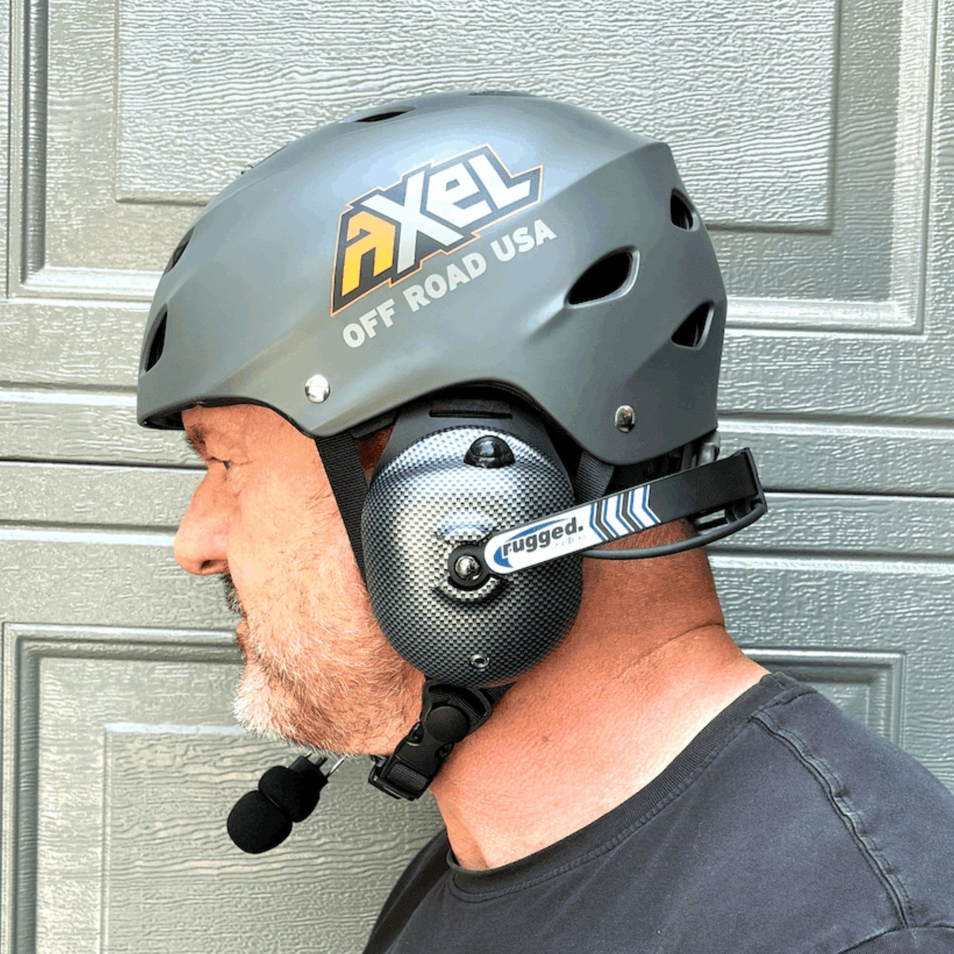 Man wearing AXEL Off Road Trail Helmet with rugged radios headset intercom