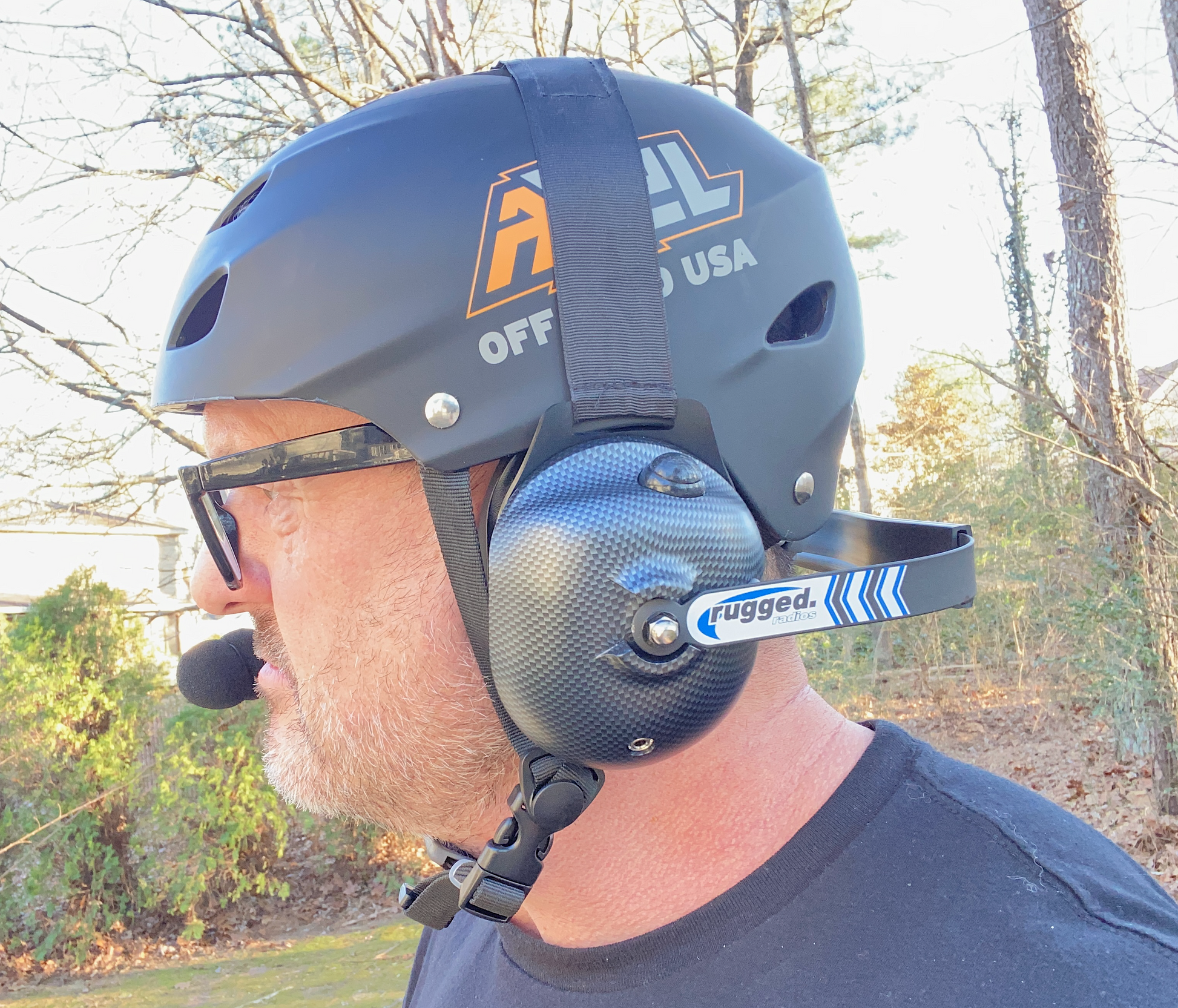 Matte Black Off Roading Helmet with an intercom headset